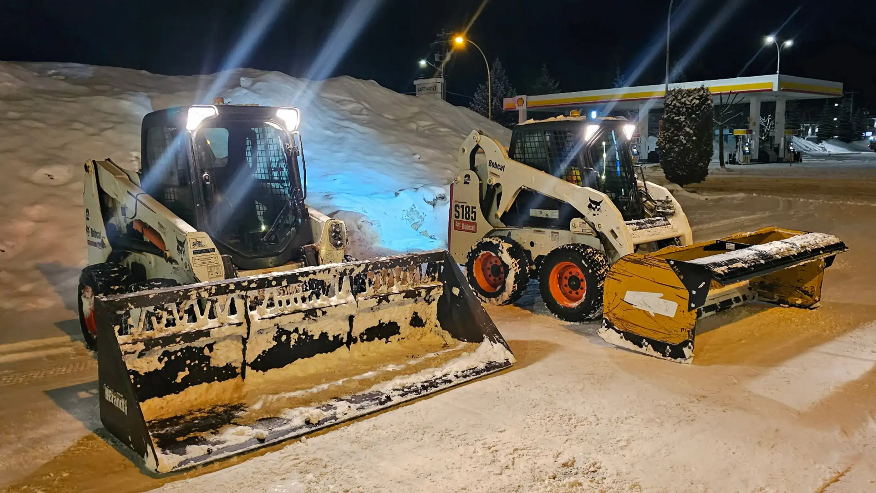 Snow Clearing Skid Steers with different attachments