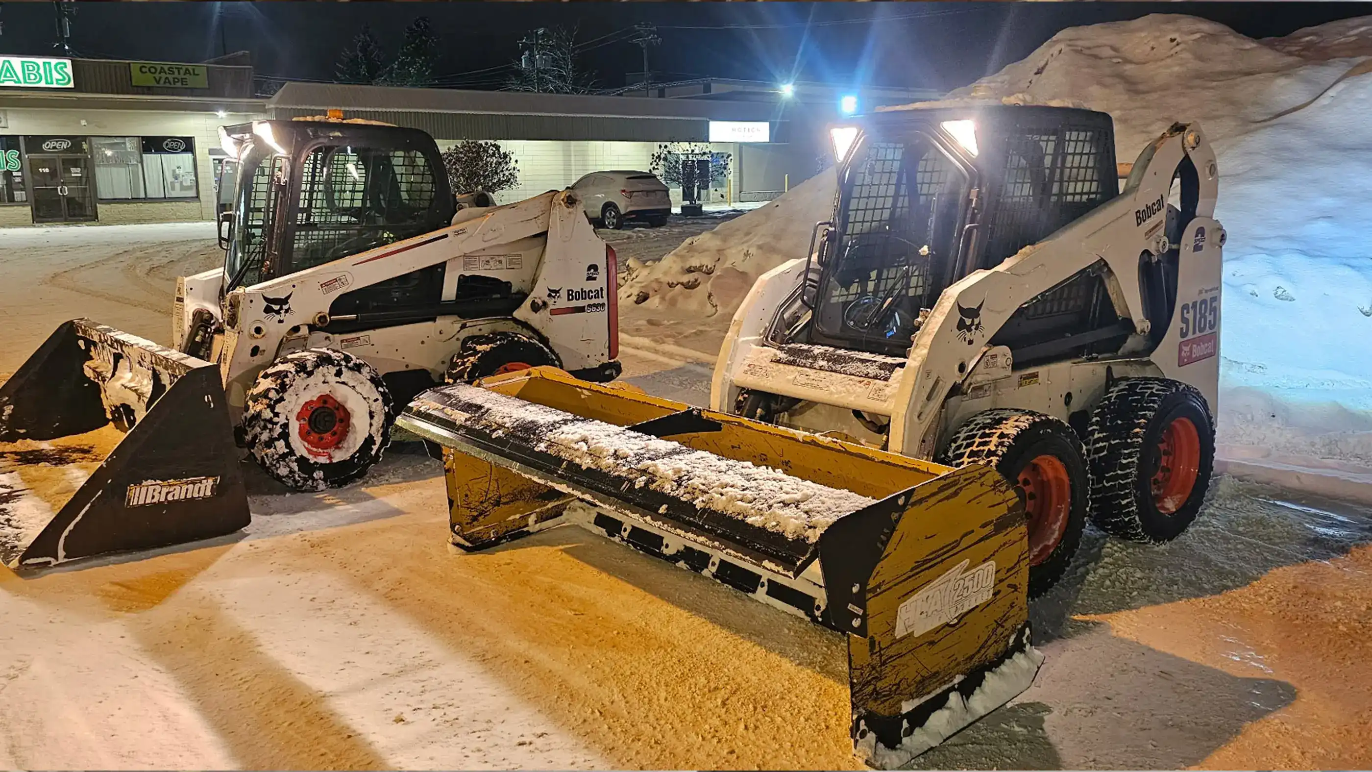 Snow Clearing Skid Steers with different attachments